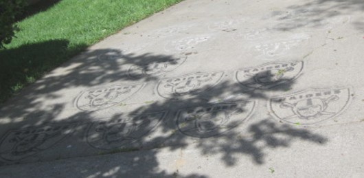 raiders logo painted on driveway